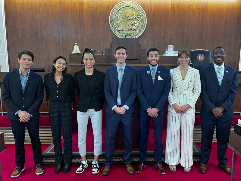 YPA members posed with legislator in NC State Senate chamber